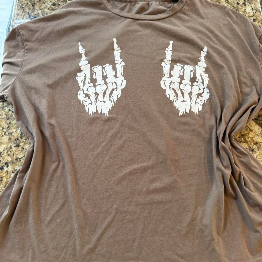 SHEIN women's oversized brown graphic tee. two white skeleton hand rock-sign
